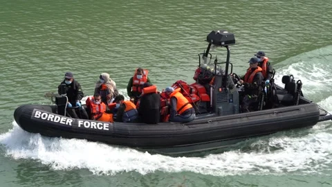 Border force bring a group of migrants into Dover port, UK. 05/08/20 Stock Footage 137549735