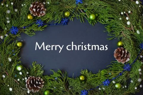 Border, frame from christmas tree branches with pine cones and blue berries Stock Photos