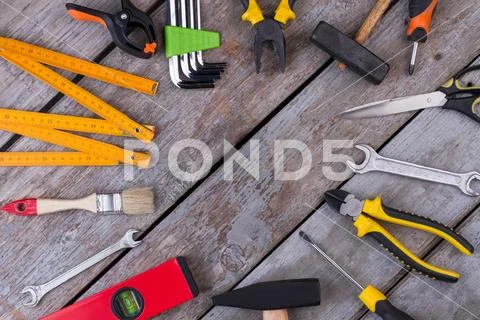 Border frame of construction tools on rustic background. ~ Premium ...