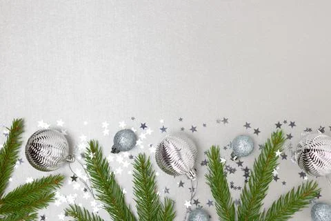 Border frame made of Christmas decorations and fir tree branches. Stock Photos