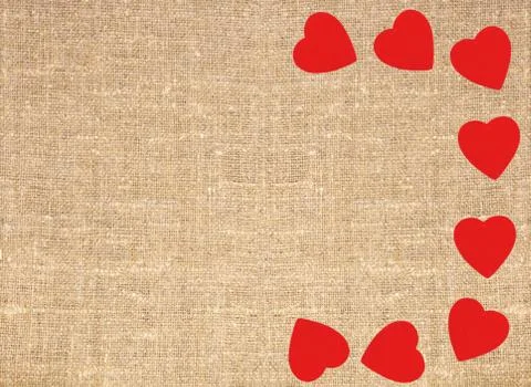 Border frame of red hearts on sack canvas burlap background texture Stock Photos