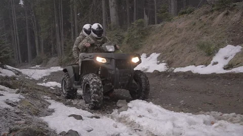 Border guards patrol the border in the mountains on an ATV Video stock 147944371