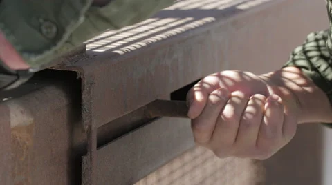 Border Patrol Agent Securing Gate of Fence Between USA and Mexico Stock Footage 60406970