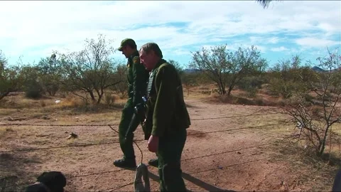 Border Patrol Agent tracking Illegal Aliens Stock Footage 217398167