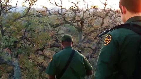 Border Patrol Agents in Field Tracking Stock Footage 170578830