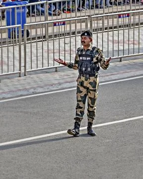 Border Security Force soldier in uniform, appealing the crowd to cheer up the Stock Photos