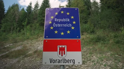 Border sign at Austrian-German state border entrance to Vorarlberg. Grenzzeichen Stock Footage 256326744