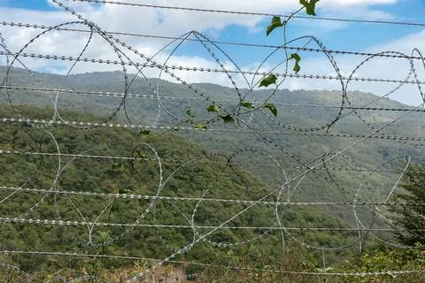 Border view between Iran and Azerbaijan with barbed wire and mountainous ba.. Stock Photos