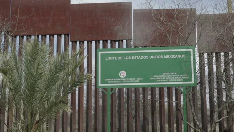 Border Wall Sign on Mexican Side of USA Mexico Border Stock Footage 220233293