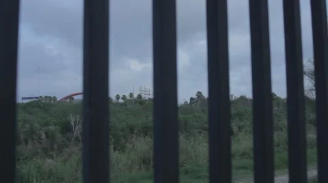 Border Wall in Texas with Mexico in the background Stock Footage 42661717