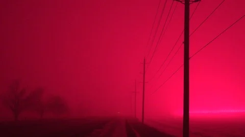 Borealis of greenhouse glows LED light pollution turns sky red at night Stock Footage 99765652