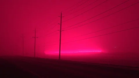 Borealis of greenhouse glows LED light pollution turns sky red at night Stock Footage 99791353