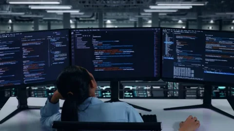 Bored Asian Woman Developer Write Code In Data Center Stock Footage 270230413