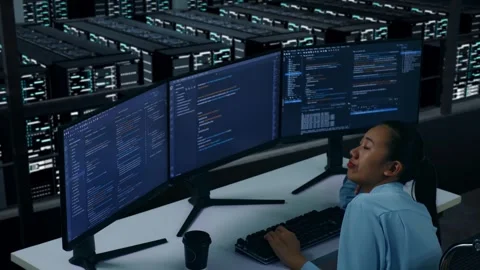 Bored Asian Woman Developer Write Code In Data Center Stock Footage 270231157