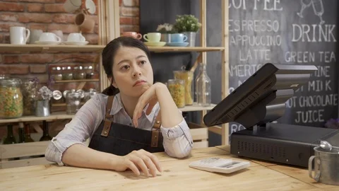 Bored barista waiting for customer in shop. Stock Footage