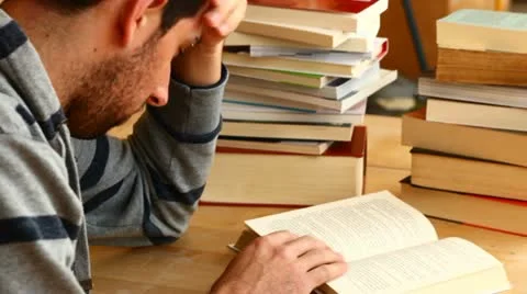 Bored boy studying Stock Footage 10895231