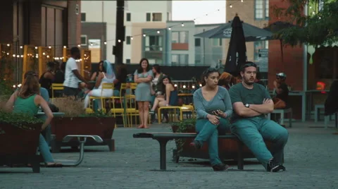 Bored Couple Sitting On Bench Stock Footage 42313084