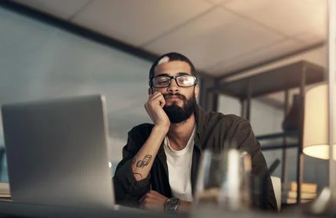 Bored, design and laptop with programmer man in office at night for coding or Stock-Fotos