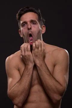 Bored dull face expression young man body Stock Photos