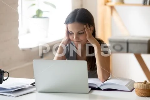 Bored girl student feel unmotivated studying at home Stock Photos