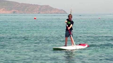 Bored Kid Over Sup Board At Sea Stock-Footage 80971629