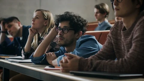 Bored Male Student Listens Lecture at the University. Tired, Exhausted Man. Stock Footage