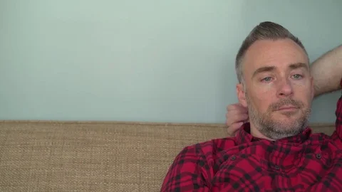 Bored man changing channels Stock Footage 72603676