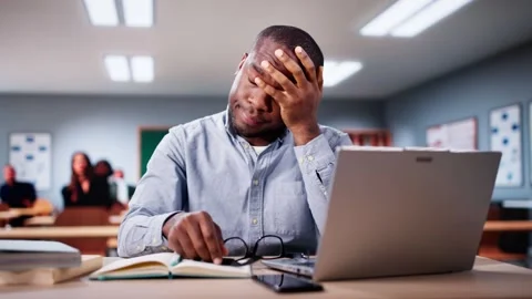 Bored Man In Classroom Using Computer Technology 스톡 동영상 293138233