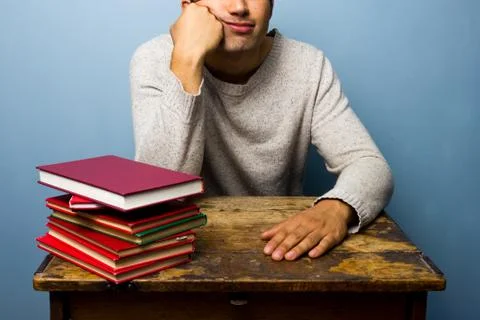 Bored man doesn't feel like reading Stock-Fotos