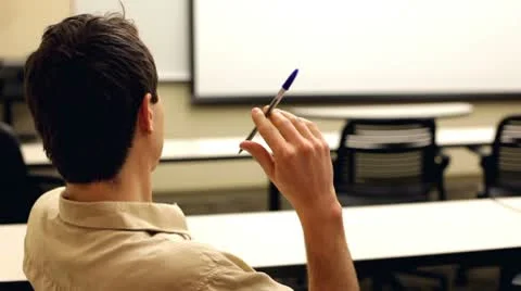 Bored man with pen in hand Stock-Footage 10720703