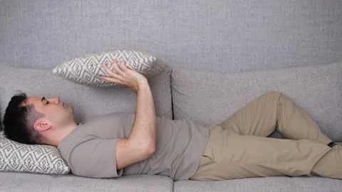 Bored man playing pillow Stock Footage 265288532