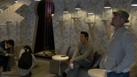 Bored Men Inside Mocha Cat Cafe In Harajuku, Tokyo, Japan Stock Footage 158990621