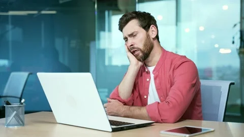 Bored men in the office Sleeping sleepy yawning boredom at workplace indoors.  Stock Footage 234149657