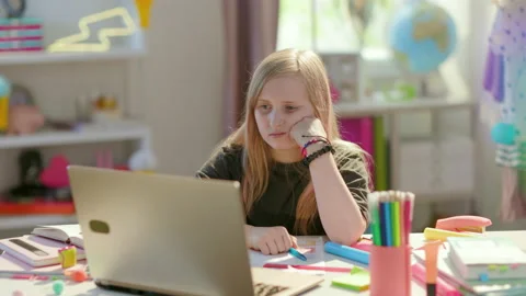 Bored modern pupil distance learning at home in sunny day Stock Footage 199527649