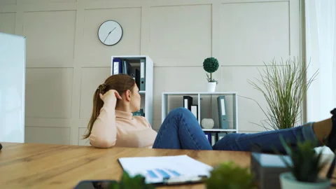 Bored office girl procrastinating at work place Video stock 131626853