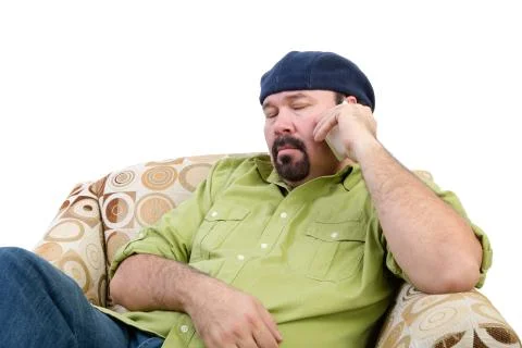 Bored overweight man using a mobile Stock Photos