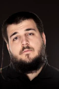 Bored portrait, guy with full beard. Stock Photos