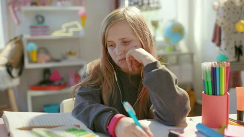 Bored pupil learning online, having call at home in sunny day Stock Footage 159367346