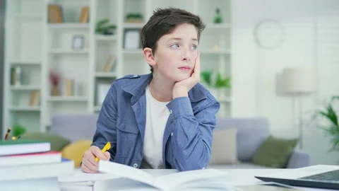 Bored schoolboy do task Tired exhausted sad upset fatigued little child boy kid  Stock Footage 238632031