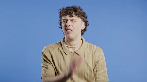 Bored Upset Man Sighs, Rolling Eyes On Blue Backdrop. Irritated Dude Displeasure 스톡 동영상 280569541