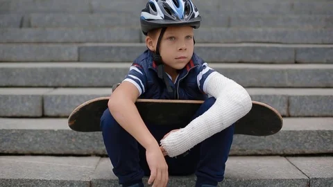 Bored white boy with broken arm Stock Footage 83996941