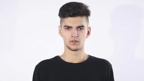 Bored young man white background Stock Footage 73032900