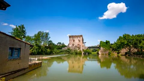 Borghetto, Reflection on the River and Bridge, Veneto, Italy Stock Photos
