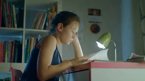A boring and tired student falling asleep at the desk Stock Footage 82422171