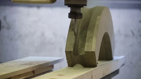 Boring machine makes a shape from a wooden workpiece. Furniture factory. Design Stock Footage 74288766