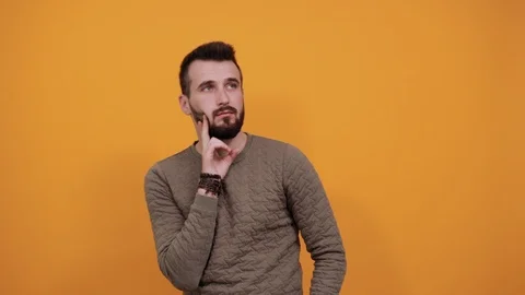 Boring man keeping hands on cheek, beard... | Stock Video | Pond5