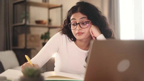Boring tired young student freelancer with glasses can not study or work Stock Footage 251731758