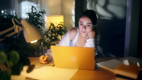 Boring tired young student freelancer studying or working write notes at home Stock Footage 264541519