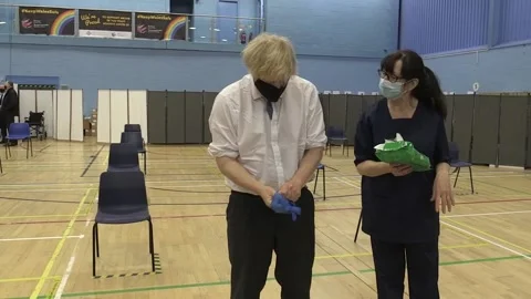 Boris Johnson makes OJ Simpson reference when struggling to put on glove Stock Footage 154689882