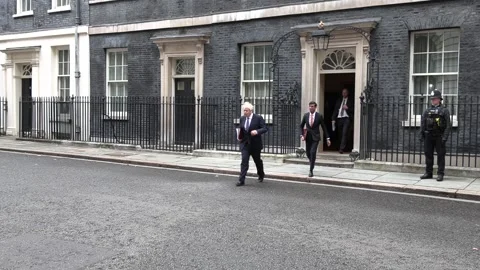 Boris Johnson PM and Rishi Sunak seen leaving 10 Downing Street Stock Footage